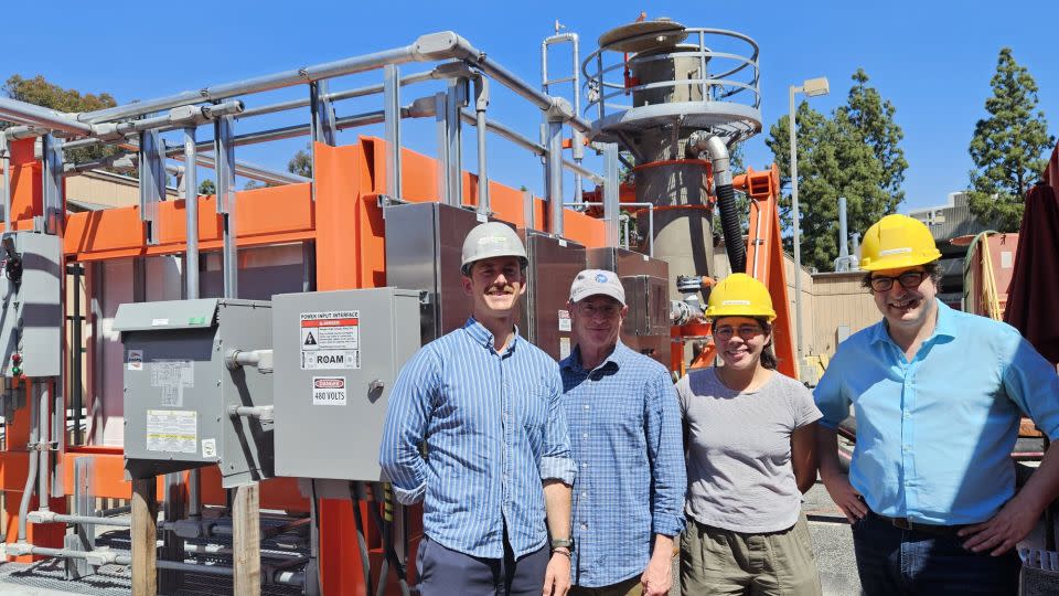 Calcarea founders Pierre Forin, Will Berelson, Melissa Gutierrez and Jess Adkins stand in front of a prototype reactor called Ripple 1 at the University of Southern California.  -Pierre Forin