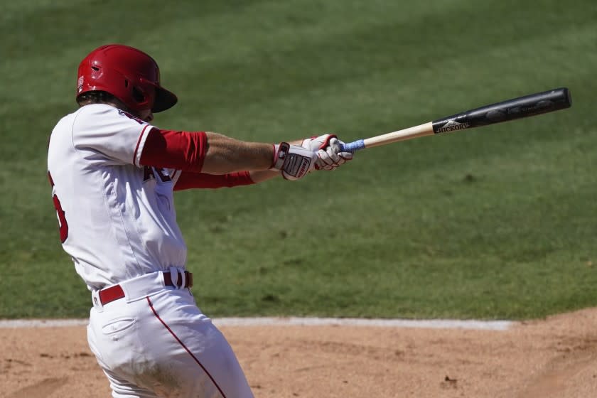 Los Angeles Angels' Jared Walsh hits a grand slam during the fourth inning of a baseball game against the Texas Rangers, Monday, Sept. 21, 2020, in Anaheim, Calif. (AP Photo/Ashley Landis)