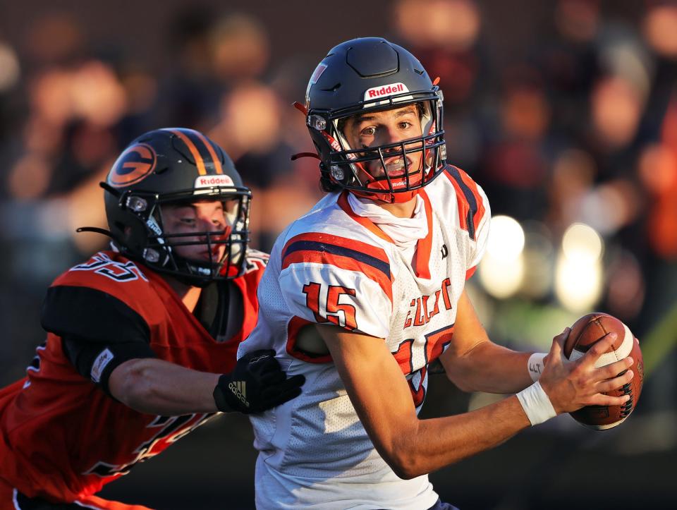 Ellet quarterback Jake Flossie scrambles to the sideline ahead of Green linebacker Matt Galemmo during the first half of a high school football game, Friday, Aug. 19, 2022, in Green, Ohio.
(Photo: Jeff Lange, Akron Beacon Journal)