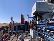 Men work on an electric drilling operating at a Chevron site in Kersey