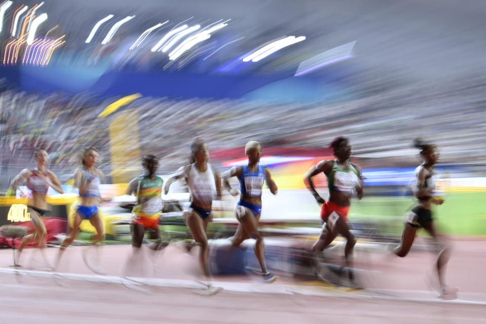Natoya Goule, of Jamaica, Noélie Yarigo, of Benin, and Ce'Aira Brown, of the United States, from right, compete during the women's 800 meters heats during the World Athletics Championships Friday, Sept. 27, 2019, in Doha, Qatar. (AP Photo/Martin Meissner)