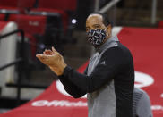 North Carolina State coach Kevin Keatts cheers on the team during the first half of an NCAA college basketball game against Wake Forest on Wednesday, Jan. 27, 2021, in Raleigh, N.C. (Ethan Hyman/The News & Observer via AP, Pool)