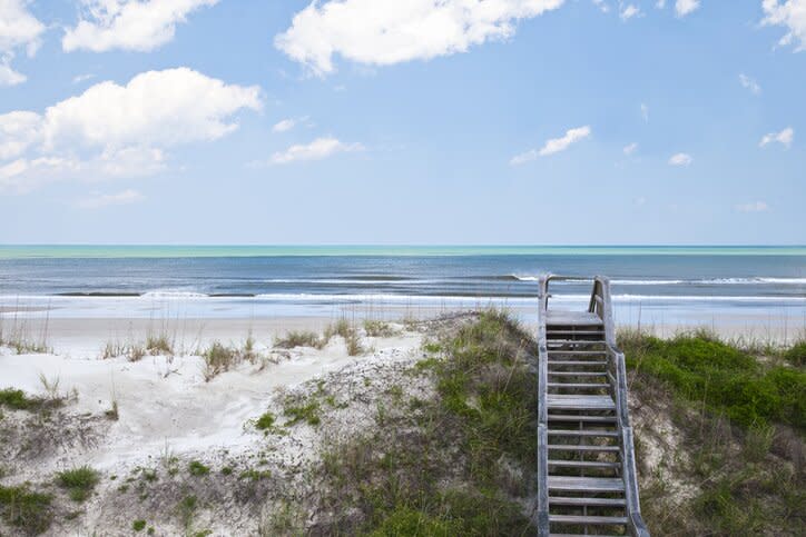 Boardwalk crossing over sand dune leading too the beach of the south atlantic ocean at "crescent beach" St.Augustine FL