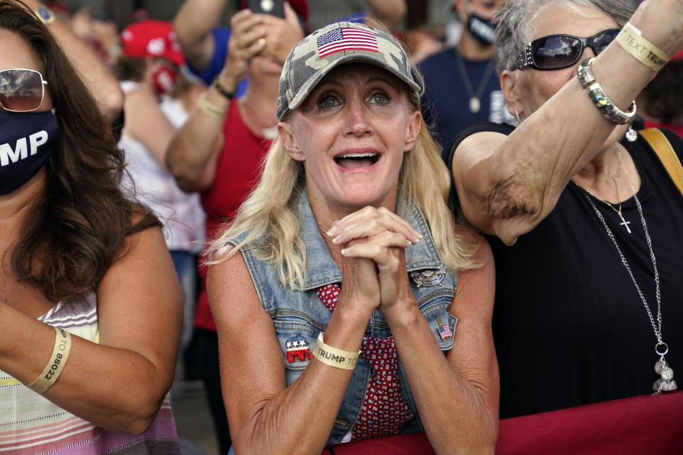 Supporters cheer as President Donald Trump speaks during a campaign rally at Wittman Airport, Monday, Aug. 17, 2020, in Oshkosh, Wis. (AP Photo/Evan Vucci)