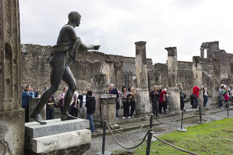 Tourists visit the Roman site of Pompei in October 2011. The hugely popular site near Naples has come to symbolise the decades of mismanagement of many of Italy's cultural treasures, as well as the fallout from recent steep cuts in budgets for culture because of austerity measures