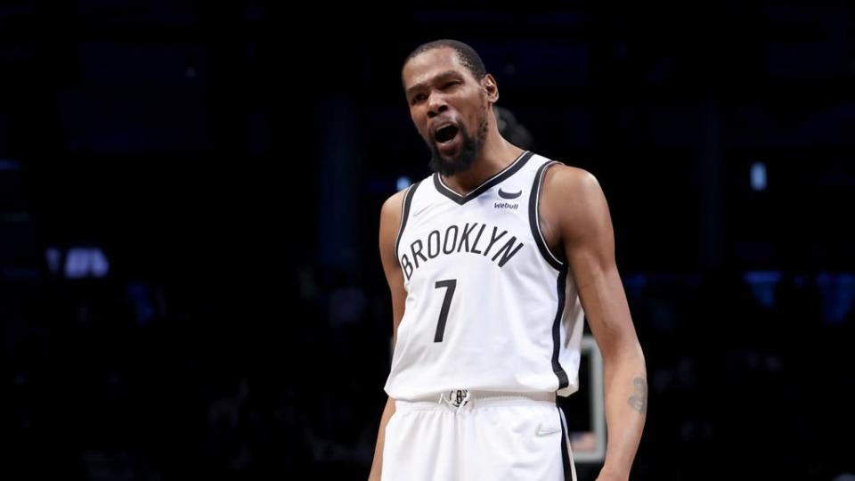 Kevin Durant reacts in white jersey no opponent visible