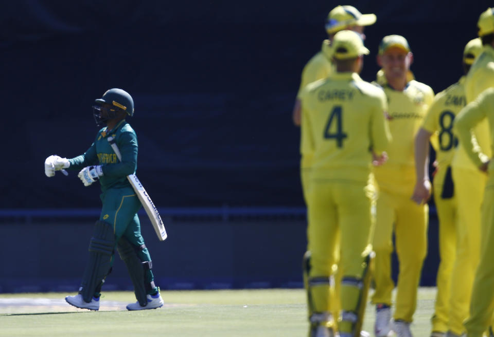 South Africa's Temba Bavuma, left, leaves the field after being dismissed during the fifth and final ODI cricket match between South Africa and Australia at the Wanderers Stadium in Johannesburg, South Africa, Sunday, Sept. 17, 2023. (AP Photo)