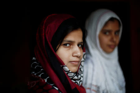FILE PHOTO: Aisha, a law student, stands inside her house house in village Nayabans in the northern state of Uttar Pradesh, India May 10, 2019. REUTERS/Adnan Abidi