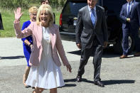 First lady Jill Biden arrives at a vaccination clinic Thursday, May 13, 2021, at a high school in Charleston, W.Va. Behind her are U.S. Sen. Joe Manchin of West Virginia and his wife, Gayle Manchin. (Kenny Kemp/Charleston Gazette-Mail via AP)