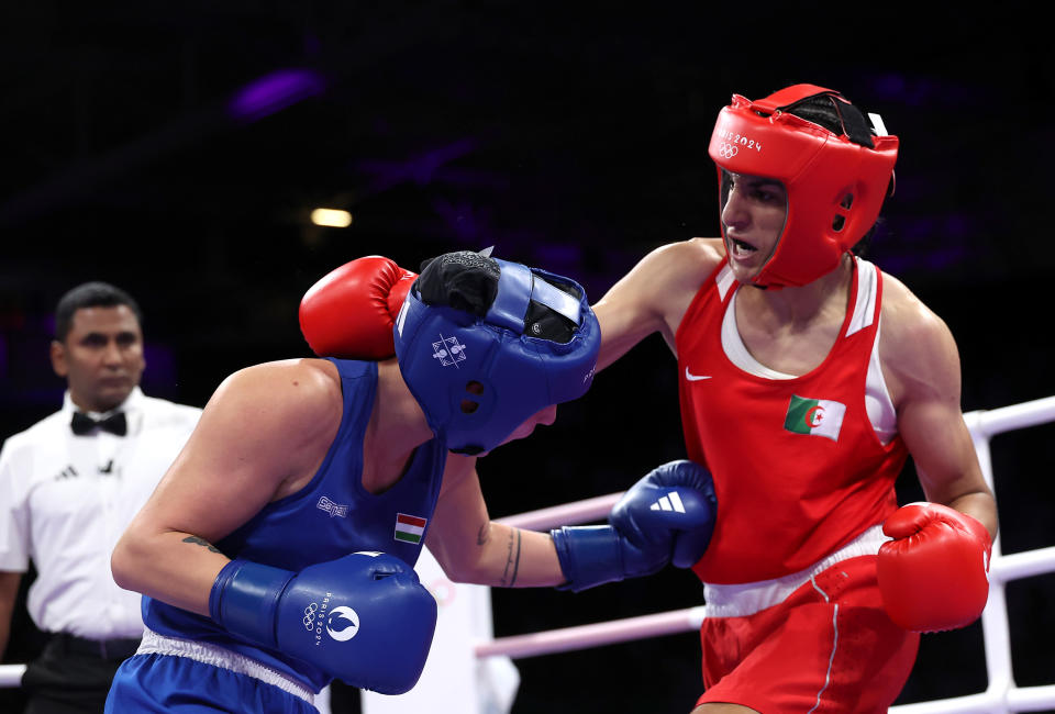 PARIS, FRANCE - AUGUST 03: Imane Khelif of Team Algeria and Anna Luca Hamori of Team Hungary exchange punches during the Women's 66kg Quarter-final round match on day eight of the Olympic Games Paris 2024 at North Paris Arena on August 03, 2024 in Paris, France. (Photo by Richard Pelham/Getty Images)