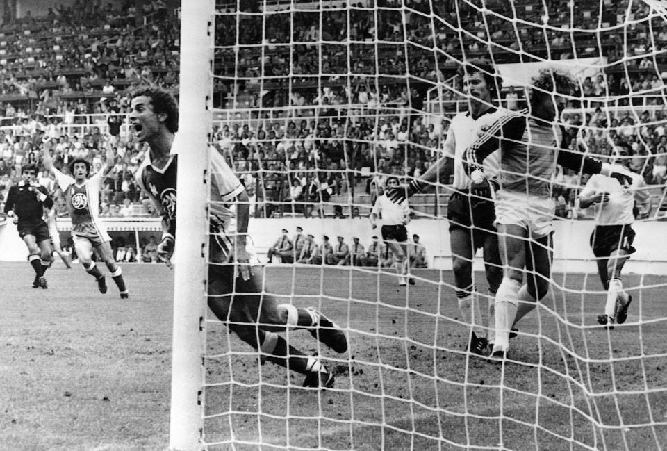 Algeria's Lakhdar Belloumi, left, celebrates after scoring winning goal against West Germany in 1982.