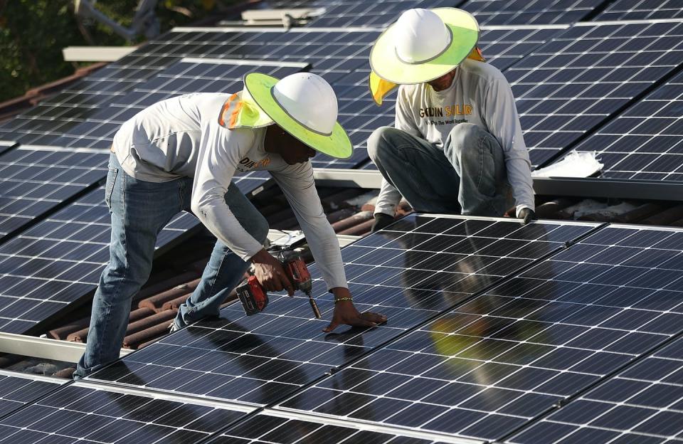 <span class="caption">The tariffs on solar panel imports raised concerns about U.S. installation jobs, which were among the fastest-growing job sectors in the country.</span> <span class="attribution"><a class="link " href="https://www.gettyimages.com/detail/news-photo/roger-garbey-and-andres-hernandez-from-the-goldin-solar-news-photo/909389746" rel="nofollow noopener" target="_blank" data-ylk="slk:Joe Raedle/Getty Images;elm:context_link;itc:0;sec:content-canvas">Joe Raedle/Getty Images</a></span>