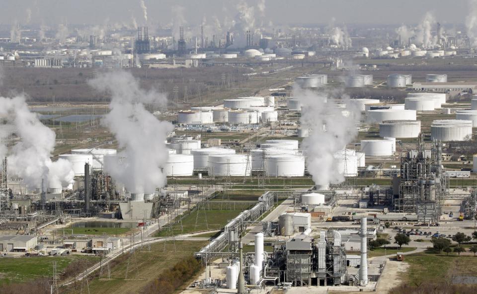 FILE - This Nov. 10, 2010 file aerial photo shows oil refineries, in Deer Park, Texas. The vast majority of economists surveyed this month by The Associated Press say lifting restrictions on exports of oil and natural gas would help the economy even if it meant higher fuel prices for consumers. (AP Photo/David J. Phillip, File)