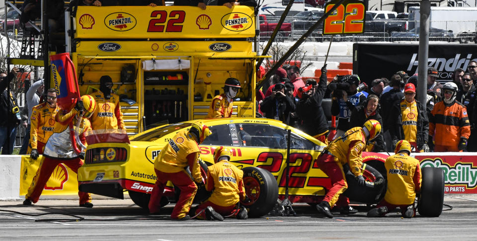 Driver Joey Logano's pit crew service his car during a NASCAR Cup auto race at Texas Motor Speedway, Sunday, March 31, 2019, in Fort Worth, Texas. (AP Photo/Larry Papke)