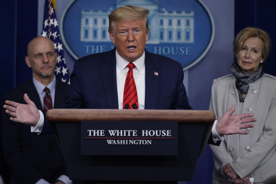 President Donald Trump speaks during press briefing with the coronavirus task force, at the White House, Thursday, March 19, 2020, in Washington. Food and Drug Administration Commissioner Dr. Stephen Hahn, at left, and Dr. Deborah Birx, White House coronavirus response coordinator, at right listen. (AP Photo/Evan Vucci)