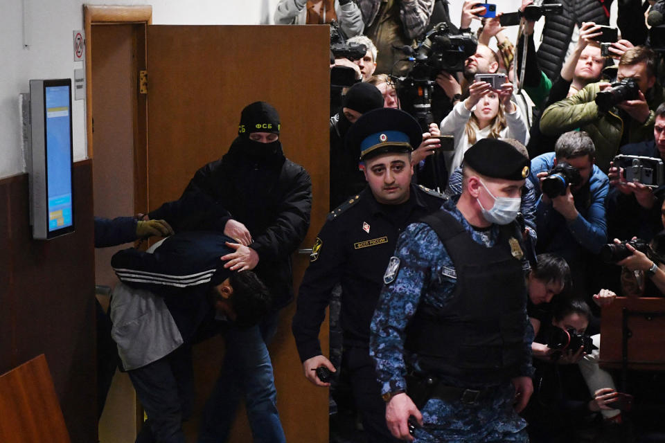 At least 137 people, including three children, were killed when camouflaged gunmen stormed the Crocus City Hall, in Moscow's northern suburb of Krasnogorsk, and then set fire to the building on March 22 evening.  (Olga Maltseva / AFP - Getty Images)