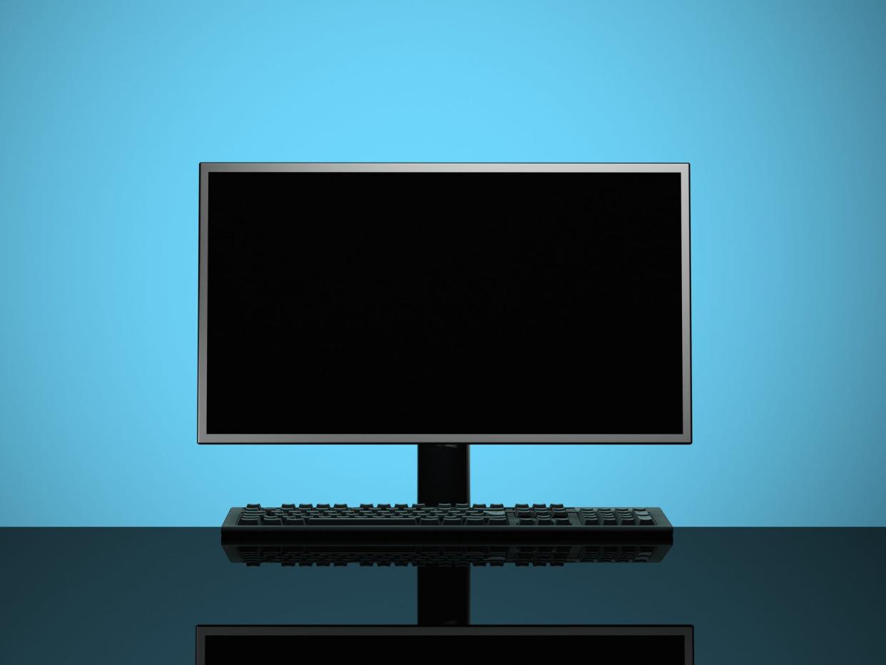 PC and keyboard on blue background