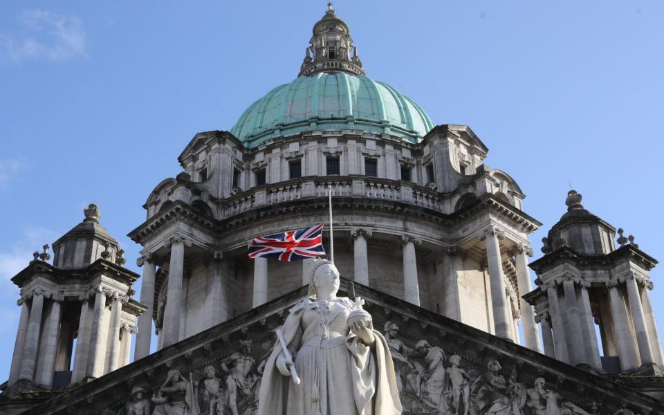 The Union flag flies at half mast over Belfast City Hall - Brian Lawless/ PA