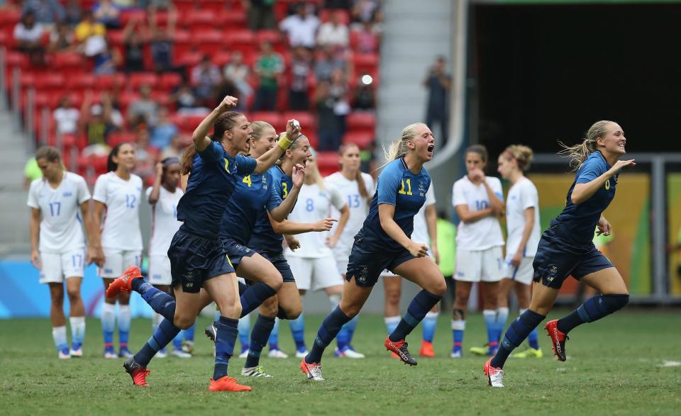 Swedish players celebrating.