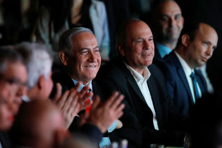 Israeli Prime Minister Benjamin Netanyahu sits in the audience ahead of a planned address at the Muni World 2018 conference in Tel Aviv, Israel February 14, 2018. REUTERS/Nir Elias