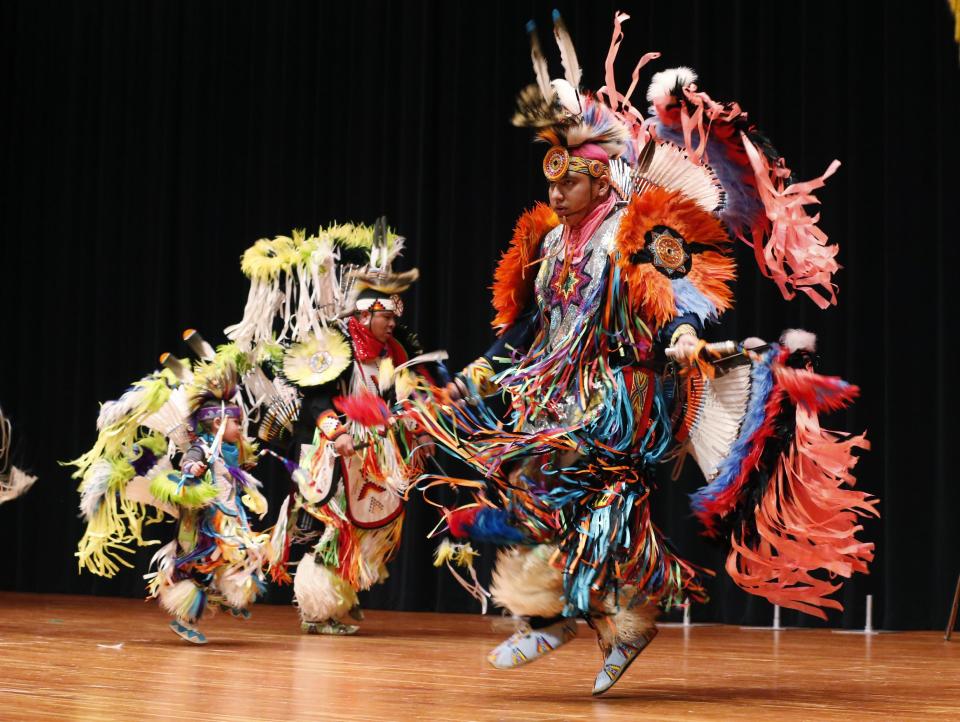 Comanche dancers perform at a ceremony honoring the Comanche Code Talkers in Lawton, Okla, Thursday, Sept. 26, 2013. (AP Photo/Sue Ogrocki)