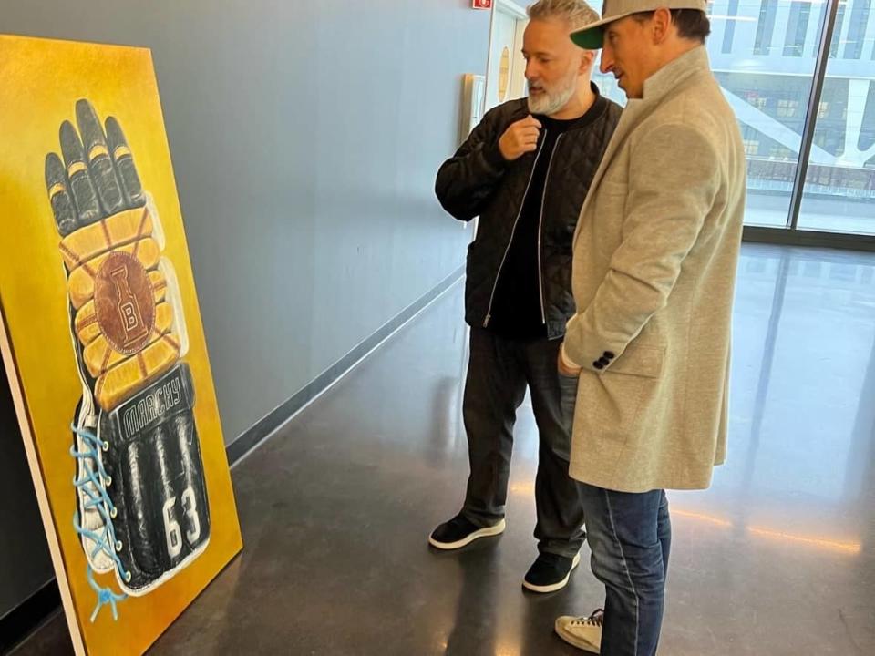 Glen McMinn and Brad Marchand had several conversations to come up with the idea for the painting. (Boston Bruins Foundation - image credit)