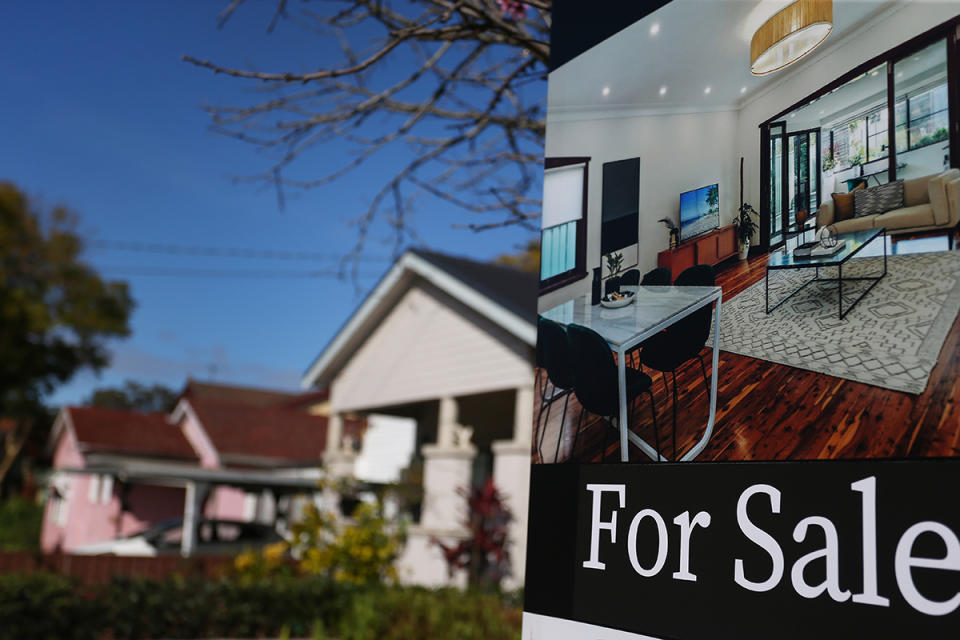 A 'for sale' sign outside a house as home loan holders fear default 