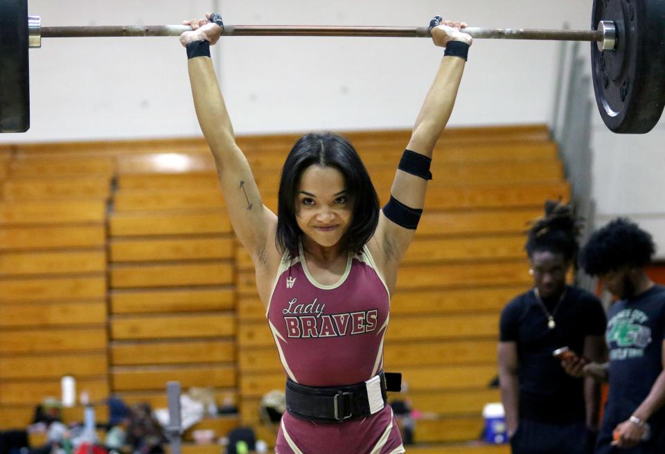 Lake Gibson's Aleesandra Diaz completes a lift at 101 pounds. She won her weight class in both the Olympics and Traditional competitions on Thursday at the Class 3A, District 10 girls weightlifting meet.