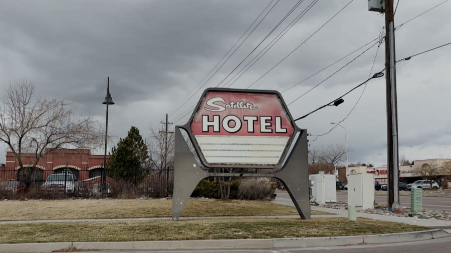 The entrance sign to the Satellite Hotel is located off Airport Road.