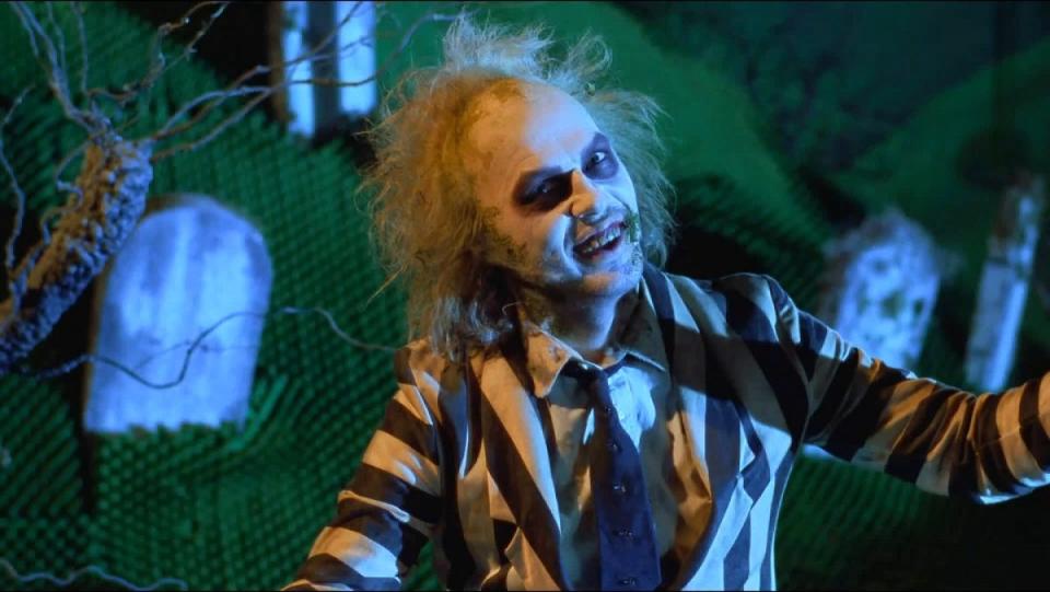 Michael Keaton in his striped suit as Beetlejuice.