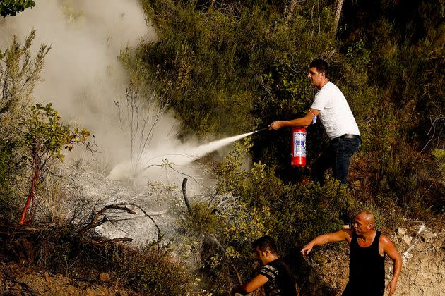 Flames have been difficult to extinguish due to the low humidity and high winds. (Photo: Anadolu Agency via Getty Images)