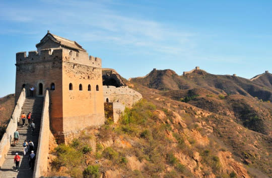 GREAT WALL OF CHINA The Great Wall of China originated in 220 B.C., when China’s first emperor Qin Shi Huang joined together fortifications built to protect northern China from invasions. The majority of the wall was built during the Ming Dynasty (1368-1644), when it became the world’s largest military structure. It spans over 20,000 kilometers from Shanhaiguan in Hebei province in the east to Jiayuguan in Gansu province in the west. The Great Wall is the only man-made structure on Earth that can be seen from the moon. Visitors can admire the watchtowers and ramparts that Chinese soldiers used as a vantage point centuries ago. Insider Tip: The Badaling section of the Wall is easily accessible from Beijing, but it tends to be overrun by tourists. The Great Wall at Mutianyu is less crowded and offers spectacular views. (Photo: FPSO/Shutterstock)