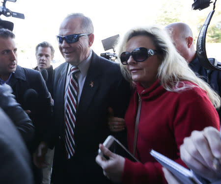 Judge Roy Moore and wife Kayla arrive to participate in the Mid-Alabama Republican Club's Veterans Day Program in Vestavia Hills, Alabama, U.S., November 11, 2017. REUTERS/Marvin Gentry