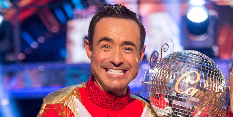 joe mcfadden and katya jones with the glitterball trophy