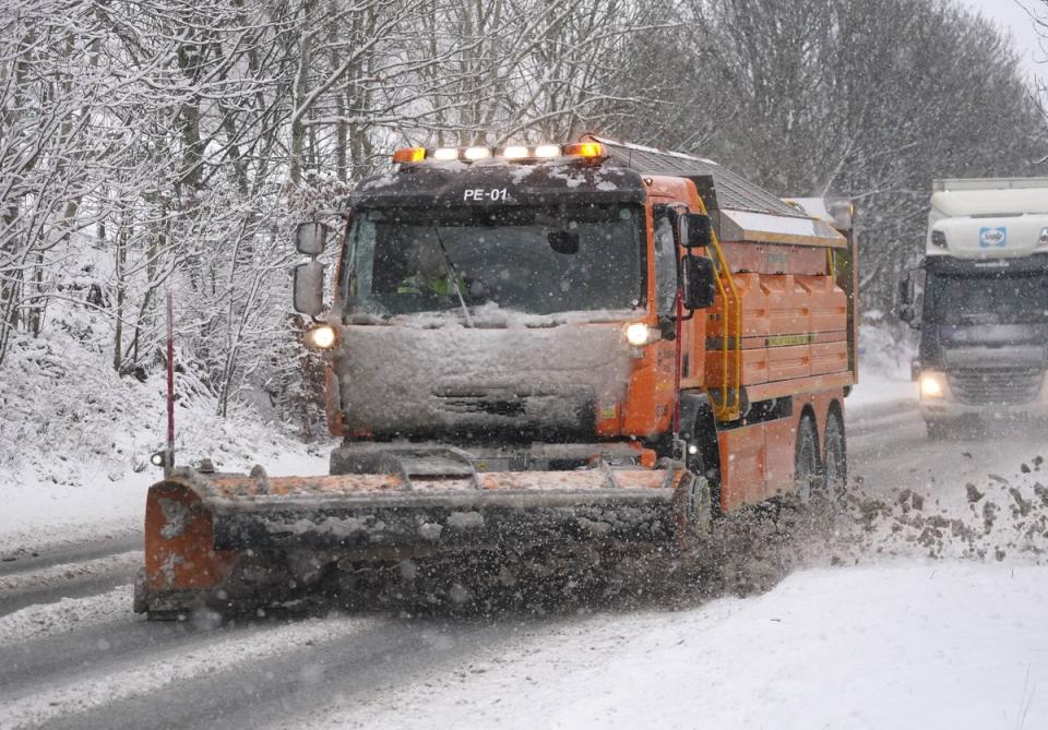 A snowplough on the A66 near Keswick in Cumbria (PA)