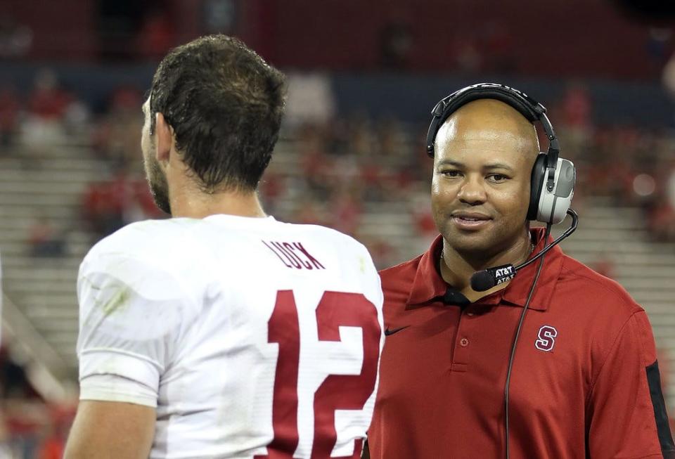 Stanford's David Shaw talks with quarterback Andrew Luck during a game against Arizona Sept. 17, 2011 in Tucson, Arizona. Stanford defeated the Wildcats 37-10.