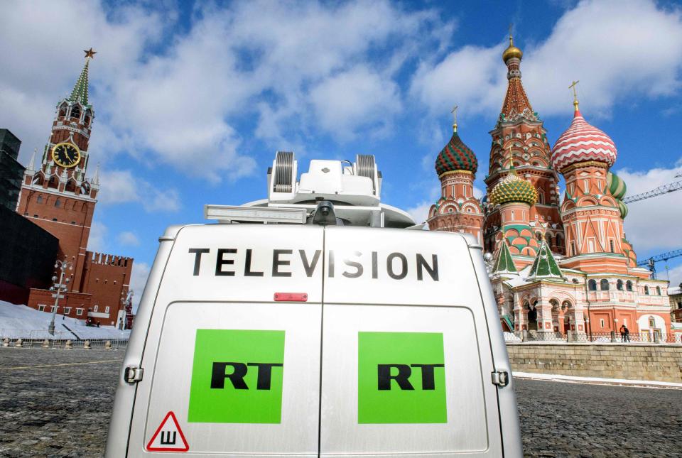 A broadcast van from Russia's state-controlled Russia Today television service parked in front of St. Basil's Cathedral and the Kremlin in Moscow.