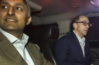 Dick Costolo (R), chief executive of Twitter, and Mike Gupta, Twitter's chief financial officer, sit in a car as they depart Morgan Stanley in advance of the firm's IPO in New York, October 25, 2013. REUTERS/Carlo Allegri