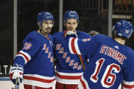 New York Rangers' Chris Kreider, left, celebrates his second-period goal against the Buffalo Sabres during an NHL hockey game Tuesday, March 2, 2021, in New York. (Bruce Bennett/Pool Photo via AP)