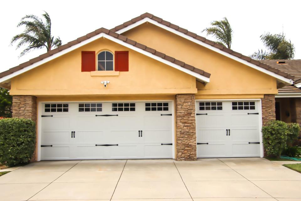 home exterior with carriage style garage doors