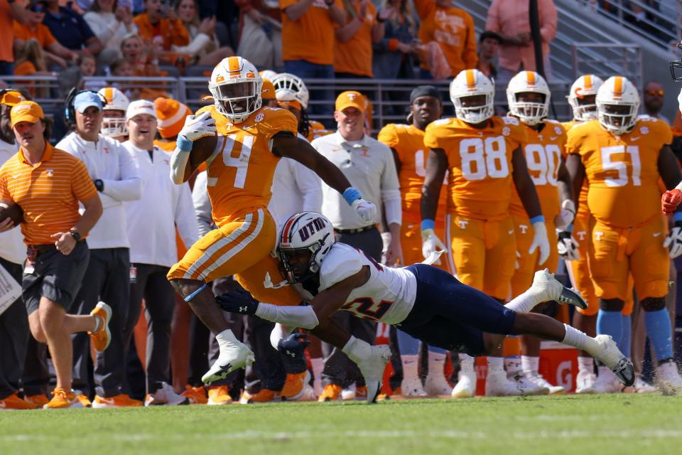 Tennessee running back Dylan Sampson (24) runs the ball against Tennessee Martin during the second half of their 2022 game at Neyland Stadium.