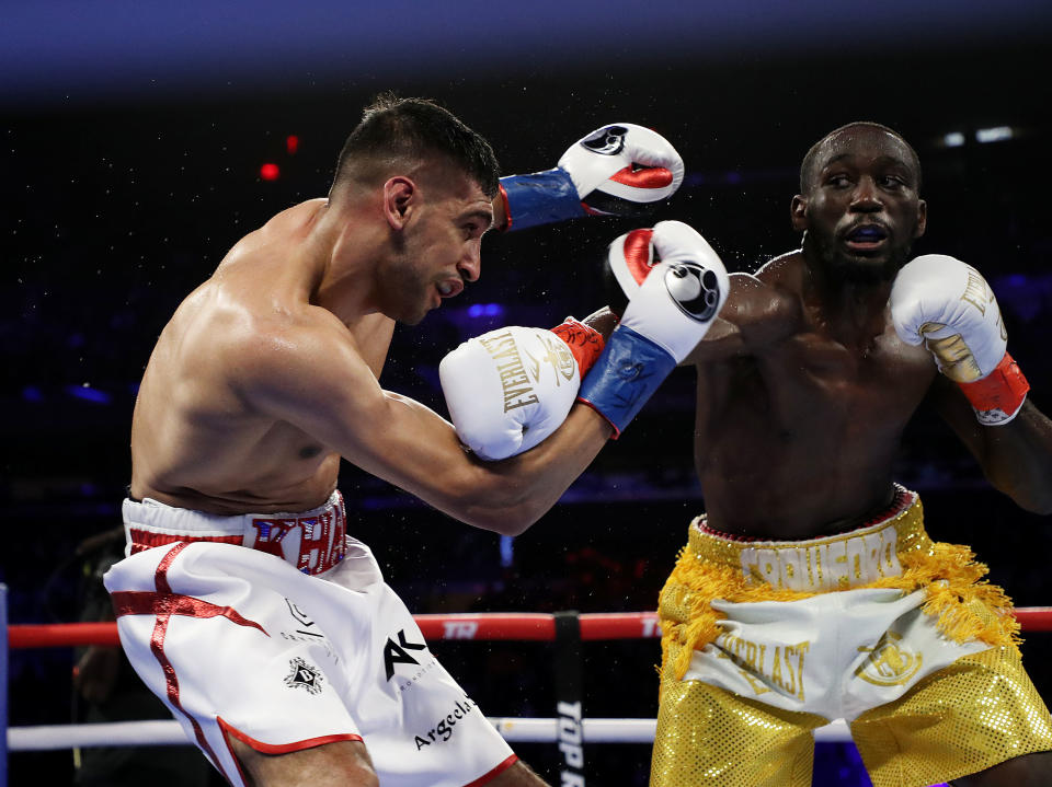 NEW YORK, NEW YORK - APRIL 20:  Terence Crawford punches Amir Khan  during their WBO welterweight title fight at Madison Square Garden on April 20, 2019 in New York City. (Photo by Al Bello/Getty Images)