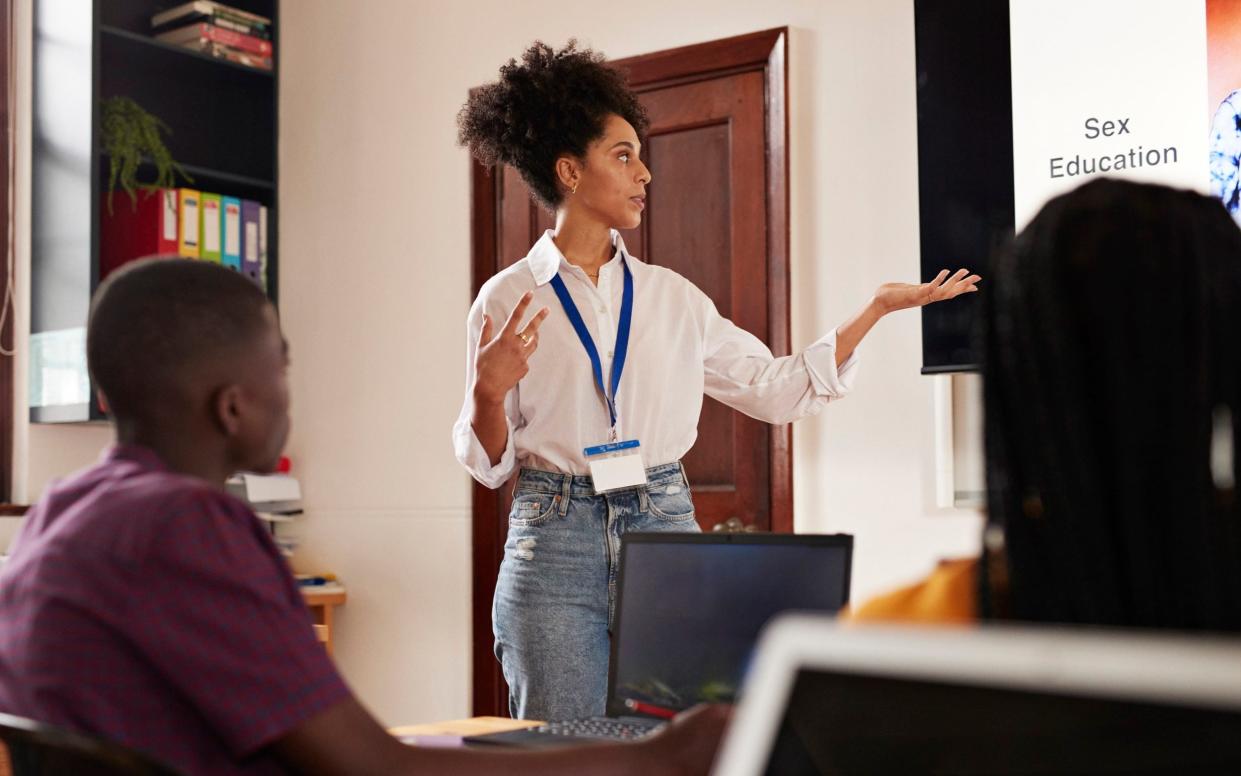 Professor teaching students about sex education