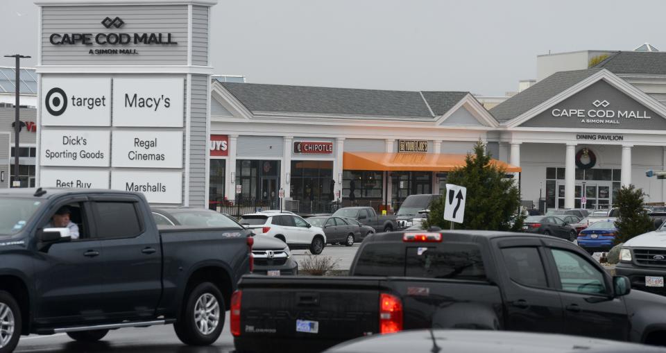 Traffic streams past the main entrance to the Cape Cod Mall on Route 132 in Hyannis on a recent weekday.