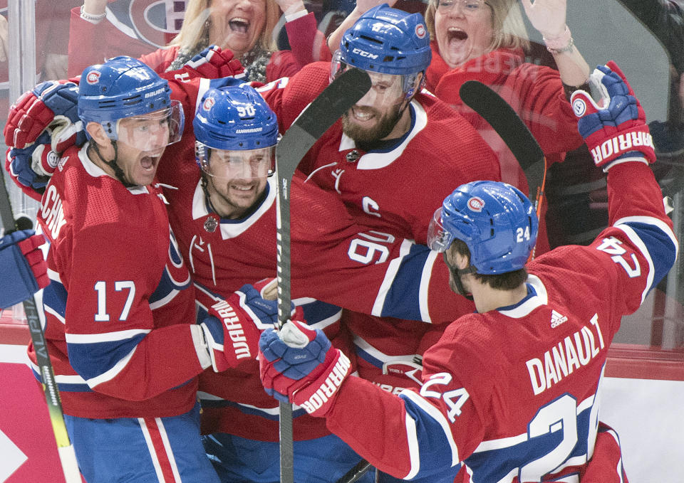 Montreal Canadiens' Ilya Kovalchuk (17) celebrates with teammates Tomas Tatar (90), Shea Weber (6) and Phillip Danault (24) after scoring against the Vegas Golden Knights during first-period NHL hockey game action in Montreal, Saturday, Jan. 18, 2020. (Graham Hughes/The Canadian Press via AP)