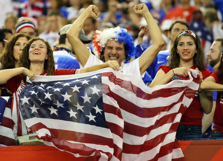 Jun 30, 2015; Montreal, Quebec, CAN; United States fans cheer after the semifinals against Germany in the FIFA 2015 Women's World Cup at Olympic Stadium. United States defeated Germany 2-0. Mandatory Credit: Jean-Yves Ahern-USA TODAY Sports