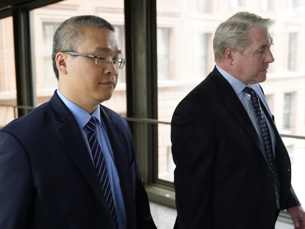 Former Minneapolis police officer Tou Thao, left, and his attorney, Robert Paule, arrive for sentencing for violating George Floyd's civil rights outside the Federal Courthouse on July 27, 2022, in St. Paul, Minn. 