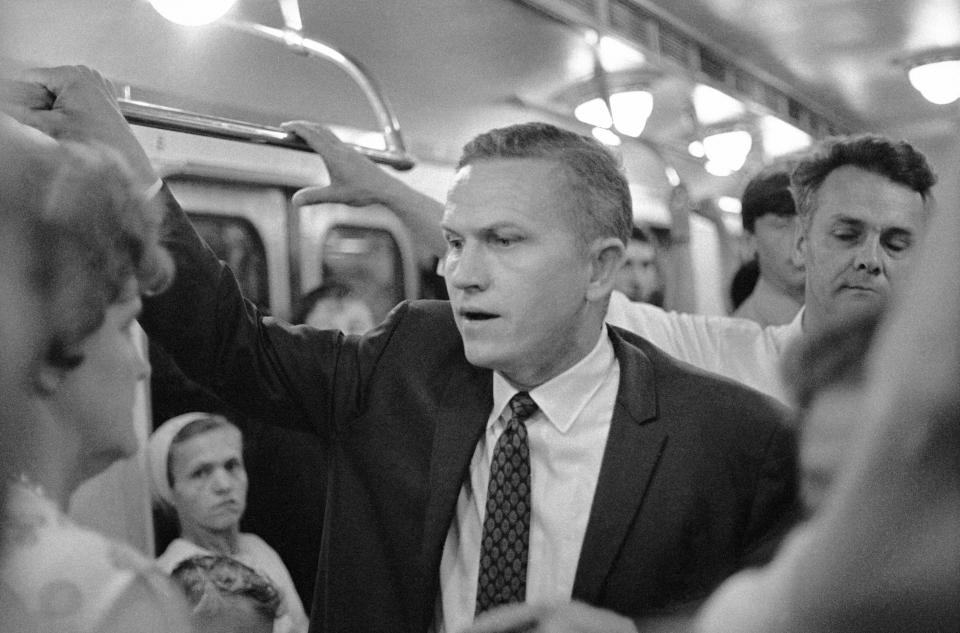 FILE - U.S. Astronaut Frank Borman chats with people on the Moscow subway in Russia, July 9, 1969. Borman, who commanded Apollo 8's historic Christmas 1968 flight that circled the moon 10 times and paved the way for the lunar landing seven months later, has died. He was 95. Borman died Tuesday, Nov. 7, 2023, in Billings, Mont., according to a NASA statement Thursday, Nov. 9. (AP Photo/File)