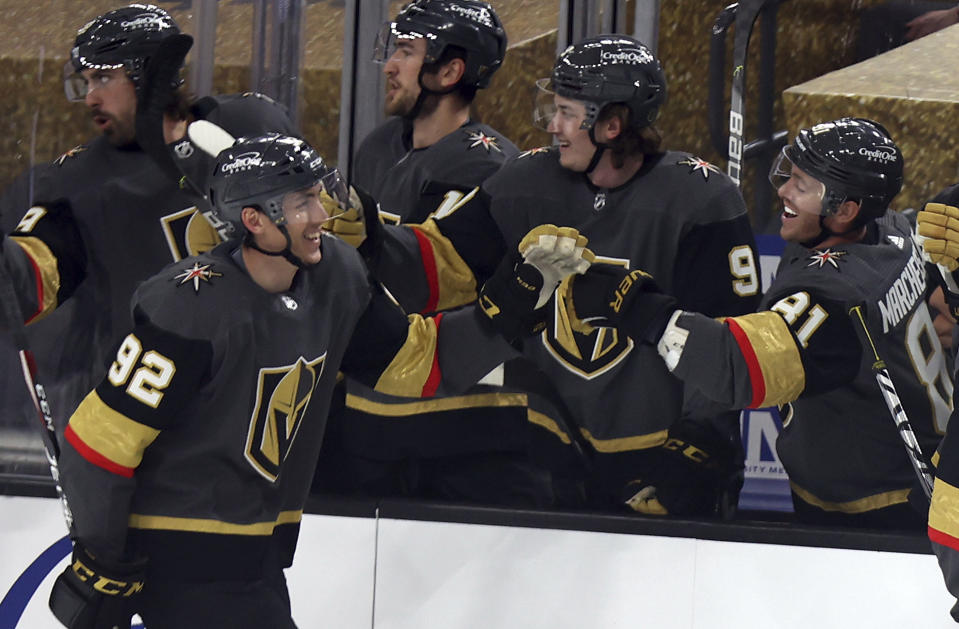 Vegas Golden Knights left wing Tomas Nosek (92) is congratulated after scoring against the Anaheim Ducks during the first period of an NHL hockey game Thursday, Jan. 14, 2021, in Las Vegas. (AP Photo/Isaac Brekken)