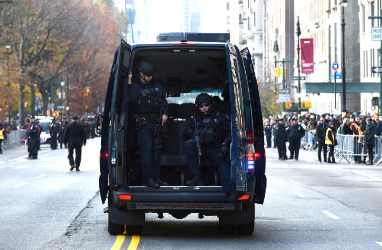 New York police officers guard the parade route during the 89th Annual Macy's Thanksgiving Day Parade on November 26, 2015 in New York City